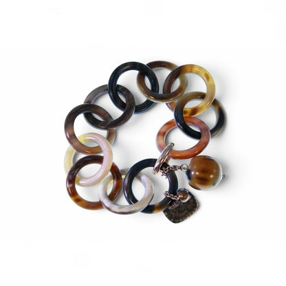 Trebor Style Amle bracelet featuring interlocking brown and tan natural horn circular links with horn and metal charms.