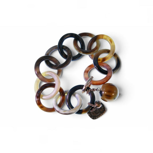 Trebor Style Amle bracelet featuring interlocking brown and tan natural horn circular links with horn and metal charms.