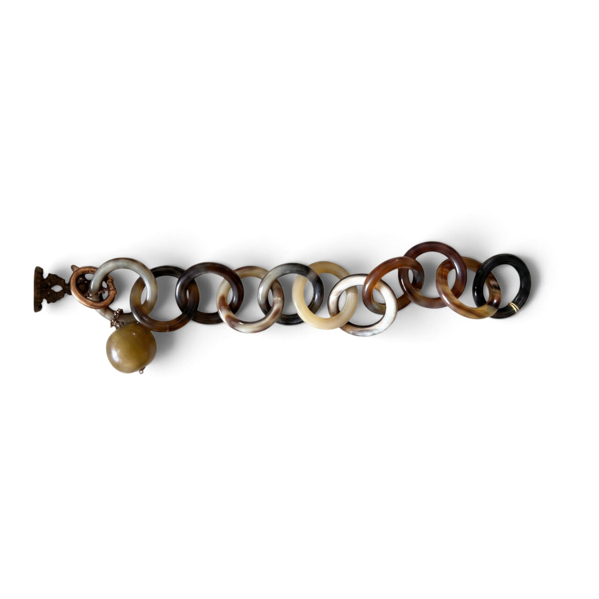 Trebor Style Amle bracelet featuring interlocking brown and tan natural horn circular links with horn charm drop.