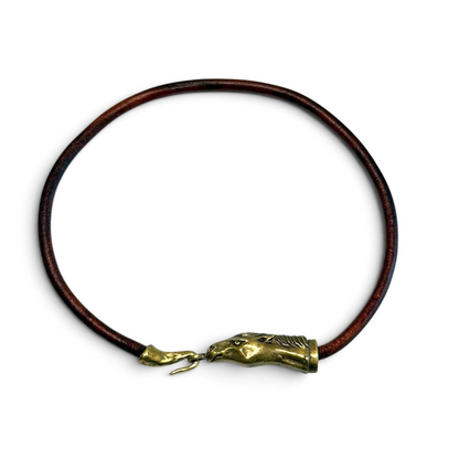 Trebor Style Wild Spirit horse choker with a dark brown leather cord and a sculpted gold patina horse head clasp.