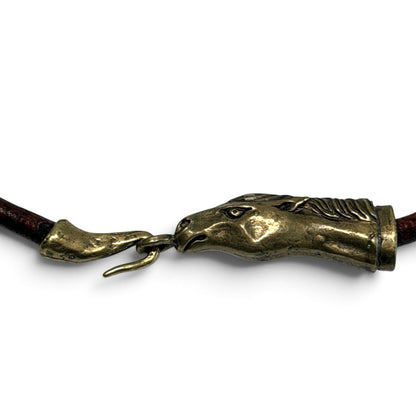 Trebor Style Wild Spirit horse head choker in reclaimed gold patina with a dark leather cord.