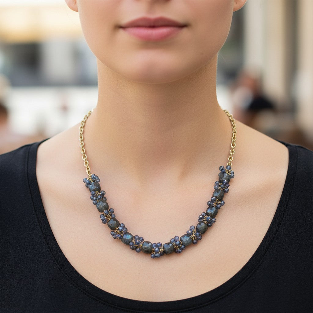 Trebor Style labradorite and London blue topaz necklace with gold-filled sterling silver chain worn on a model.