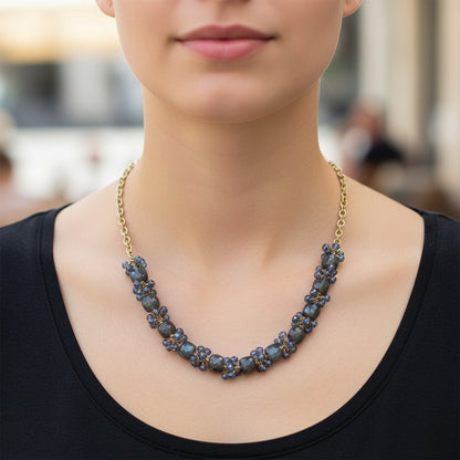 Trebor Style labradorite and London blue topaz necklace with gold-filled sterling silver chain worn on a model.