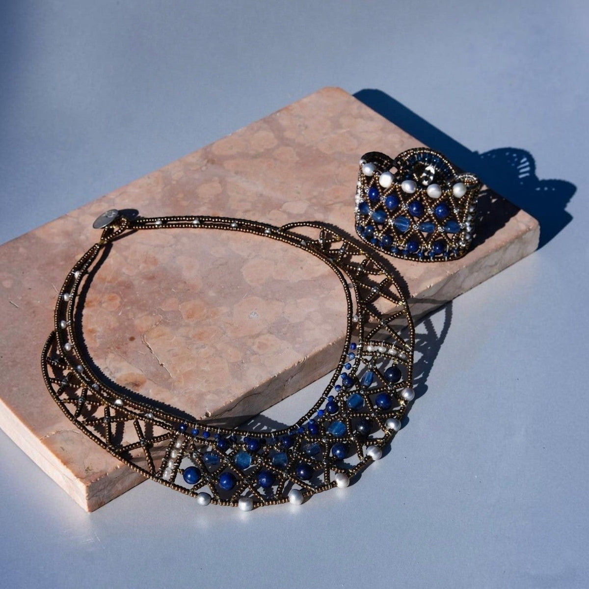 Trebor Style handcrafted necklace and cuff set featuring blue lapis, kyanite, Murano glass beads, and freshwater pearls.
