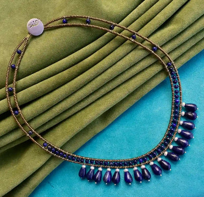 Trebor Style Lapis Lazilu dance necklace featuring blue lapis gemstones, water pearls, and Murano glass on steel wire.
