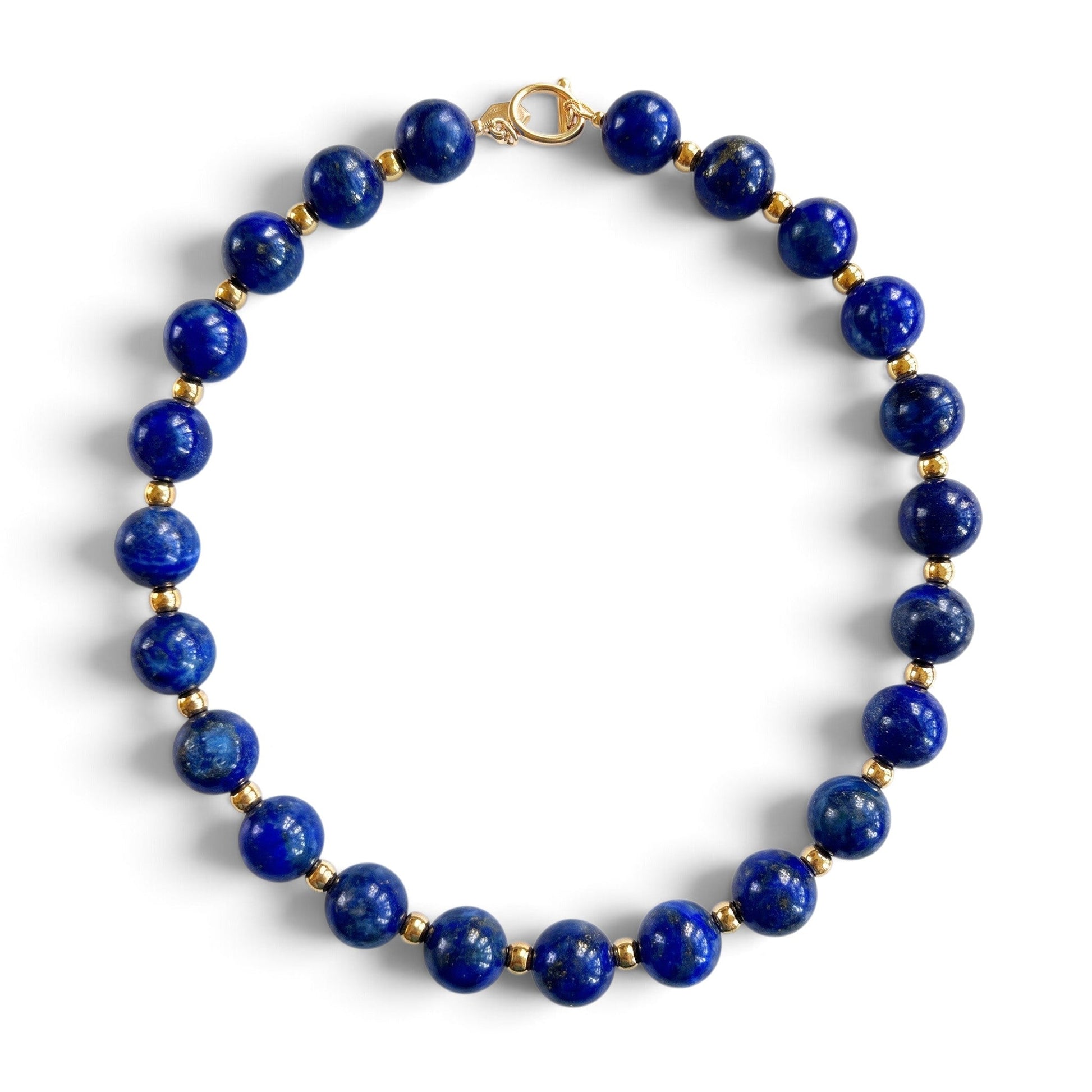 Trebor Style 20-inch statement necklace featuring 12mm natural blue lapis lazuli beads and gold-plated brass accents.