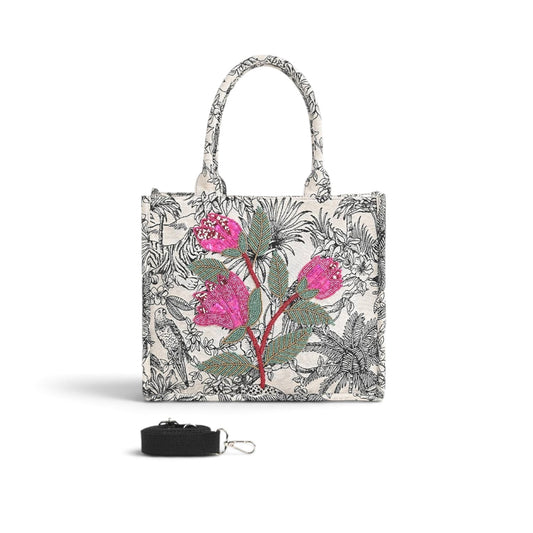 Trebor Style structured tote bag in black and cream leopard print with pink and red beaded floral embellishment.