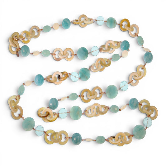 Trebor Style long necklace featuring tan horn, turquoise chalcedony, crystal, and pearl beads on rose gold silver chain.