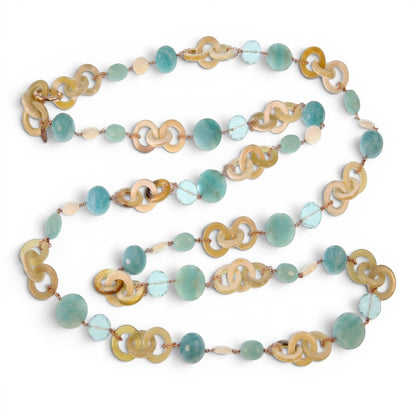 Trebor Style long necklace featuring tan horn, turquoise chalcedony, crystal, and pearl beads on rose gold silver chain.