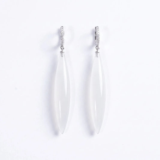 Trebor Style long drop earrings featuring translucent white stone pendants on silver-tone pavé hoop settings.