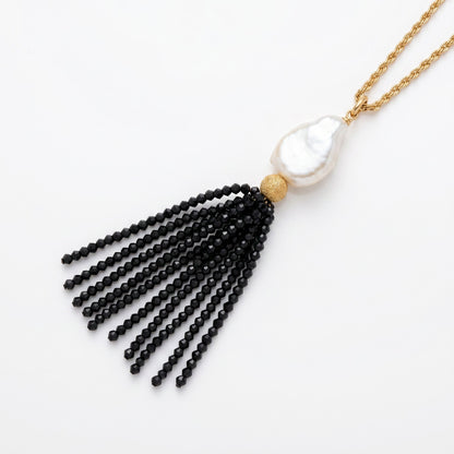 Trebor Style long necklace featuring a white Mabe pearl and a black spinel gemstone tassel on a gold-filled chain.