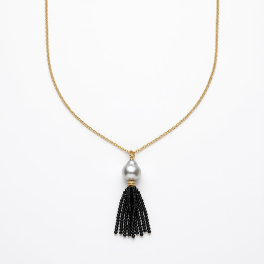 Trebor Style long necklace featuring a white Mabe pearl and a black spinel gemstone tassel on a gold-filled chain.