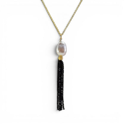 Trebor Style long necklace featuring a white Mabe pearl and a black spinel gemstone tassel on a gold filled chain.