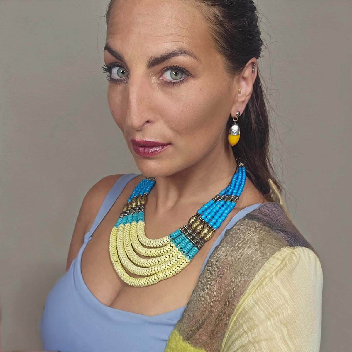 Trebor Style Masha Archer 5-strand statement necklace with yellow and blue snake beads and gold-washed silver spacers.