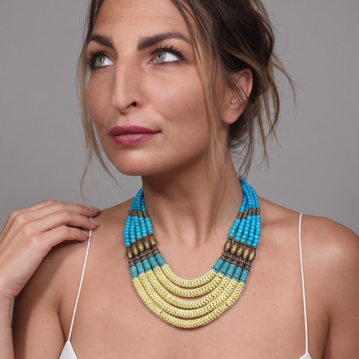 Trebor Style Masha Archer 5-strand statement necklace with yellow and blue glass snake beads and gold-washed spacers.