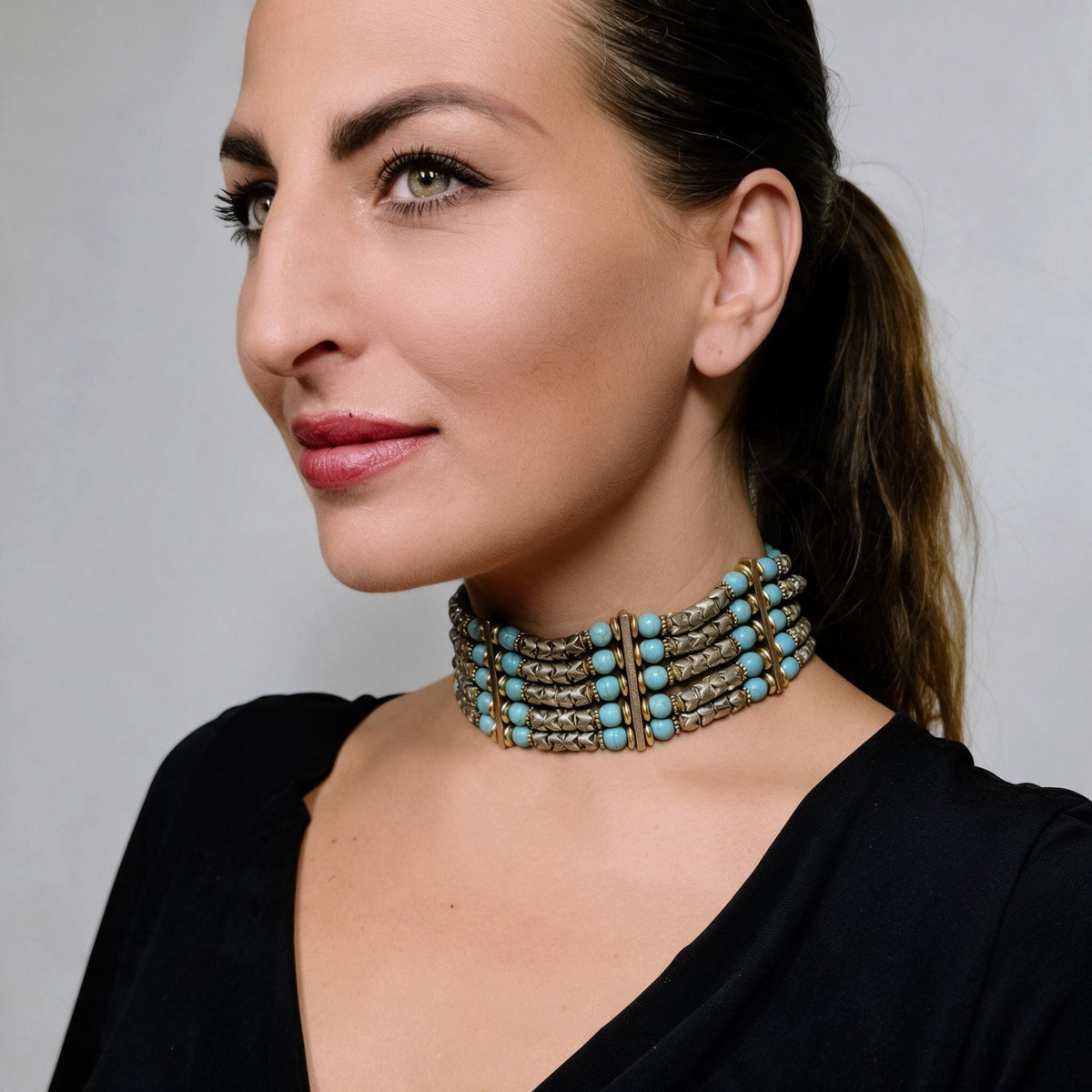 Trebor Style Masha Archer five strand choker with turquoise glass beads and silver plated snake beads on a model