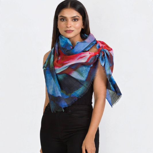 Trebor Style Leela merino wool shawl featuring an abstract watercolor rose print in blue, red, green, and black.