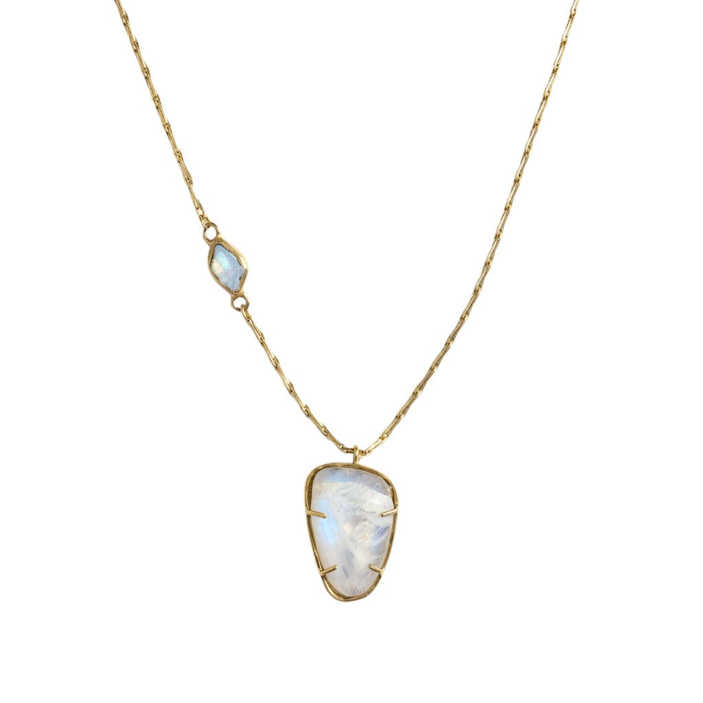 Trebor Style Hazy Sky pendant necklace featuring a rose-cut moonstone and aquamarine set in brass on a delicate chain.
