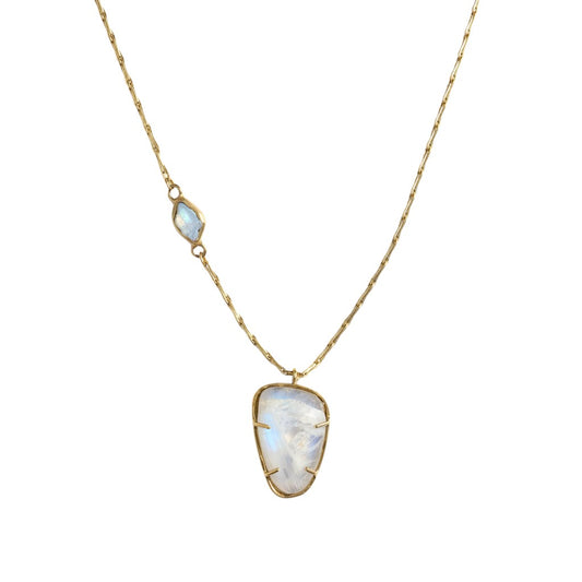 Trebor Style Hazy Sky pendant necklace featuring a rose-cut moonstone and aquamarine set in brass on a delicate chain.