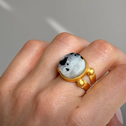 Trebor Style 16mm round-cut moonstone ring with a chunky gold-filled adjustable band worn on a finger