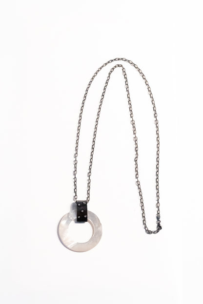 Trebor Style long necklace featuring a round mother of pearl disc pendant on an oxidized sterling silver chain.