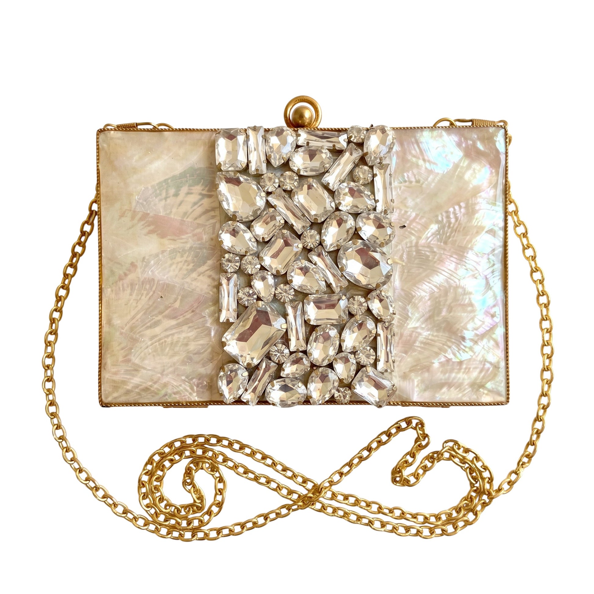Trebor Style Krystal clutch in mother of pearl with a central panel of sparkling stones and a gold chain strap.