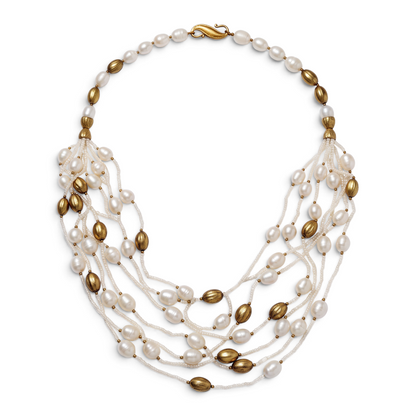 Trebor Style multi-strand necklace featuring white freshwater pearls and 14k gold plated oval beads with hook closure.