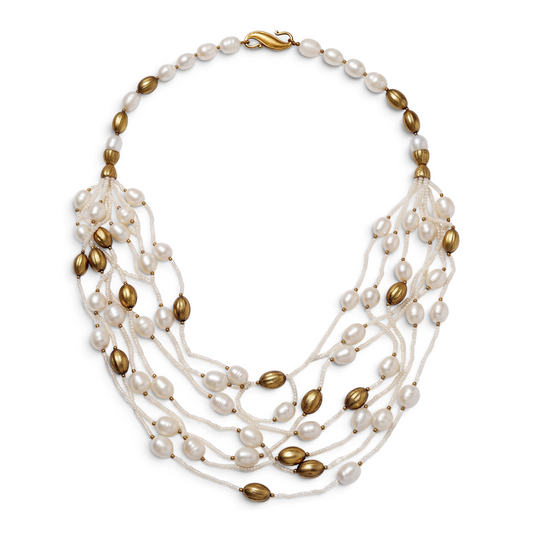 Trebor Style multi-strand necklace featuring white freshwater pearls and 14k gold plated oval beads with hook closure.