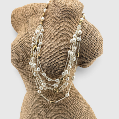 Trebor Style multi-strand necklace featuring white freshwater pearls, seed pearls, and 14k gold plated oval beads.