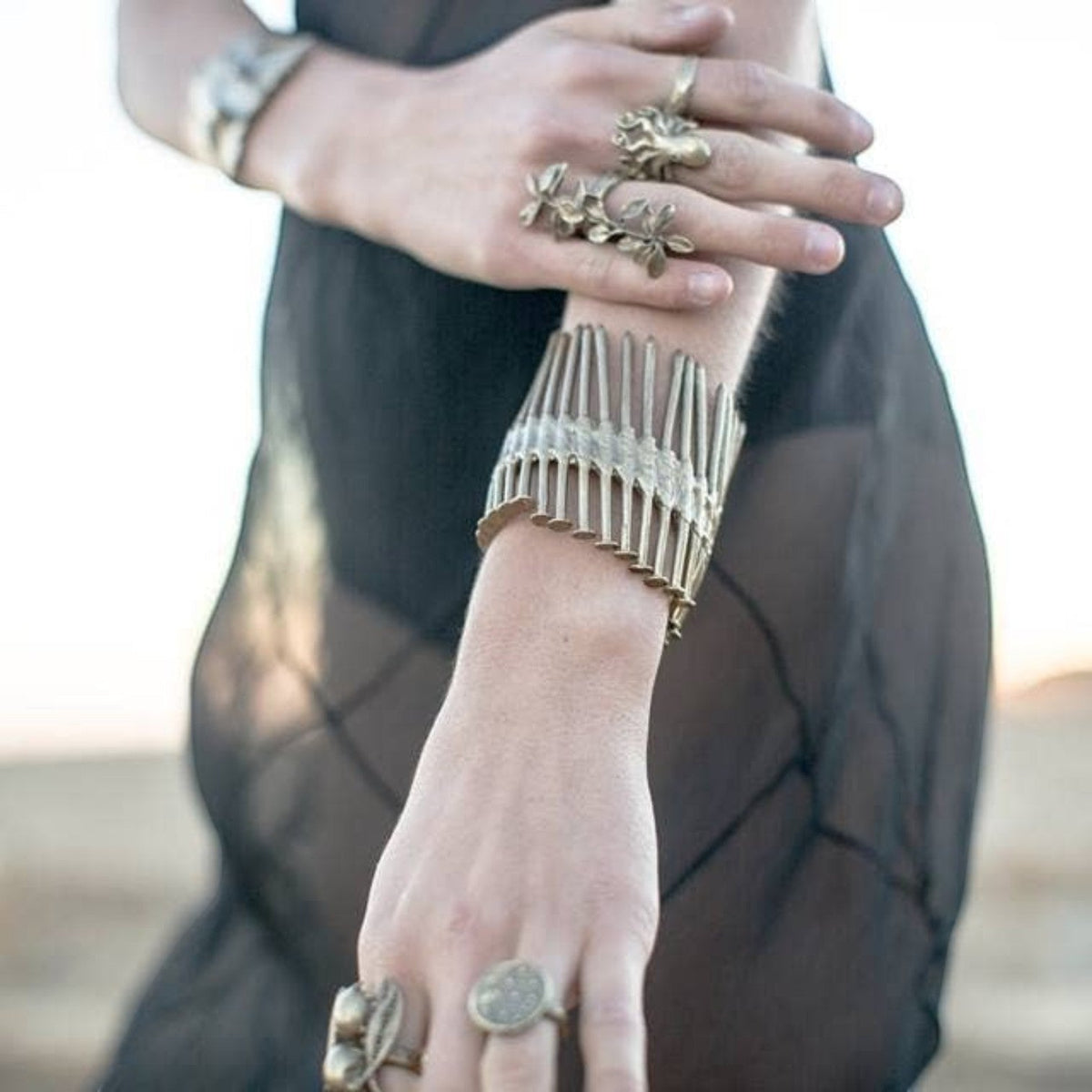 Trebor Style Nails Cuff made of reclaimed copper and zinc, featuring an industrial nail design worn on a wrist
