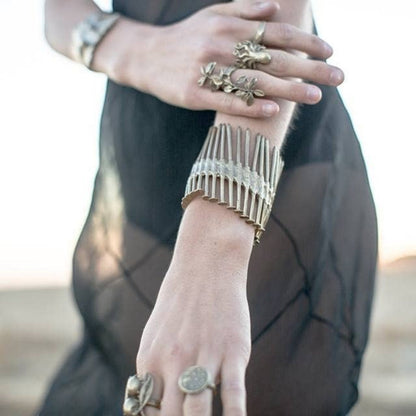 Trebor Style Nails Cuff made of reclaimed copper and zinc, featuring an industrial nail design worn on a wrist