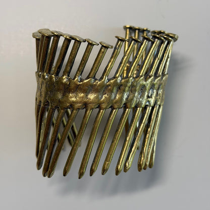 Trebor Style Nails Cuff made from reclaimed copper and zinc in a gritty, industrial nail gun nail design.