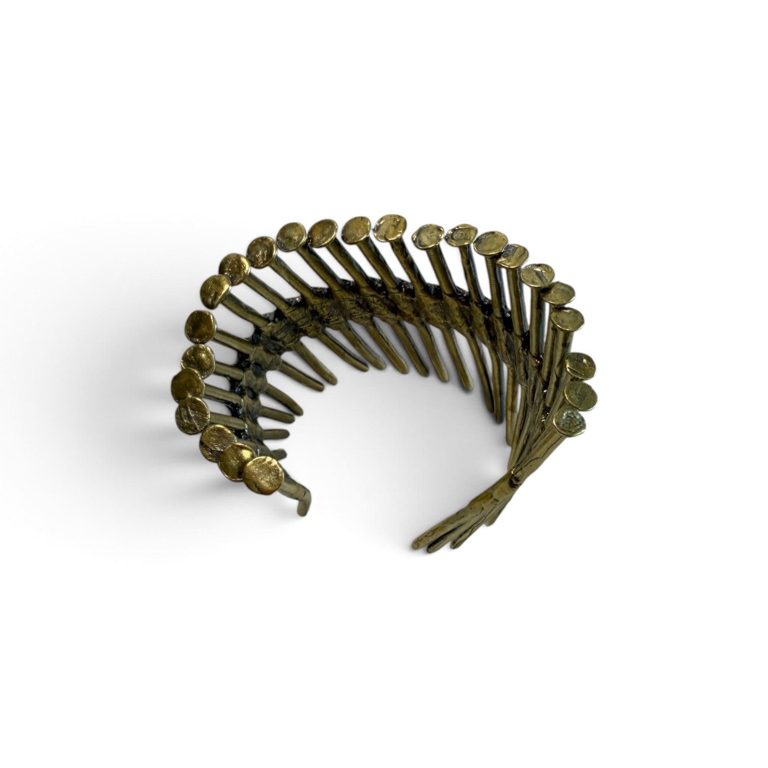Trebor Style industrial cuff bracelet made from reclaimed copper and zinc nail gun nails with a raw metallic finish.