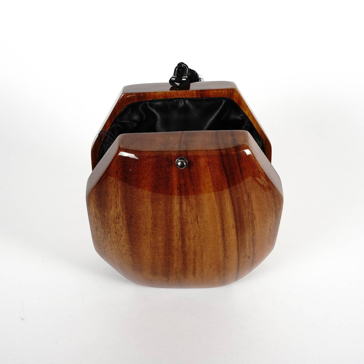 Trebor Style octagon handbag handcrafted from natural acacia wood with a black tassel and satin lining.