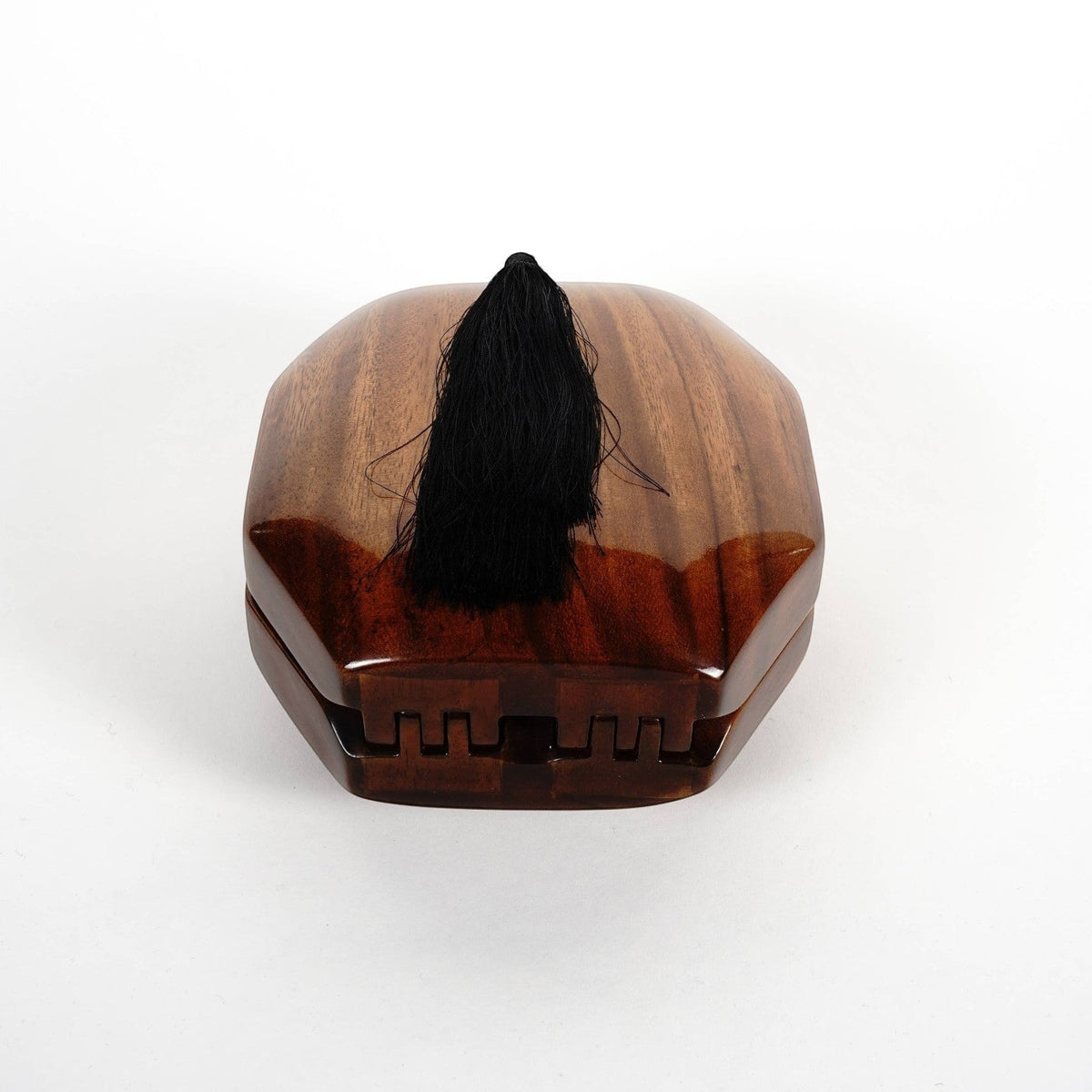 Trebor Style octagon handbag handcrafted from natural acacia wood featuring a decorative black tassel