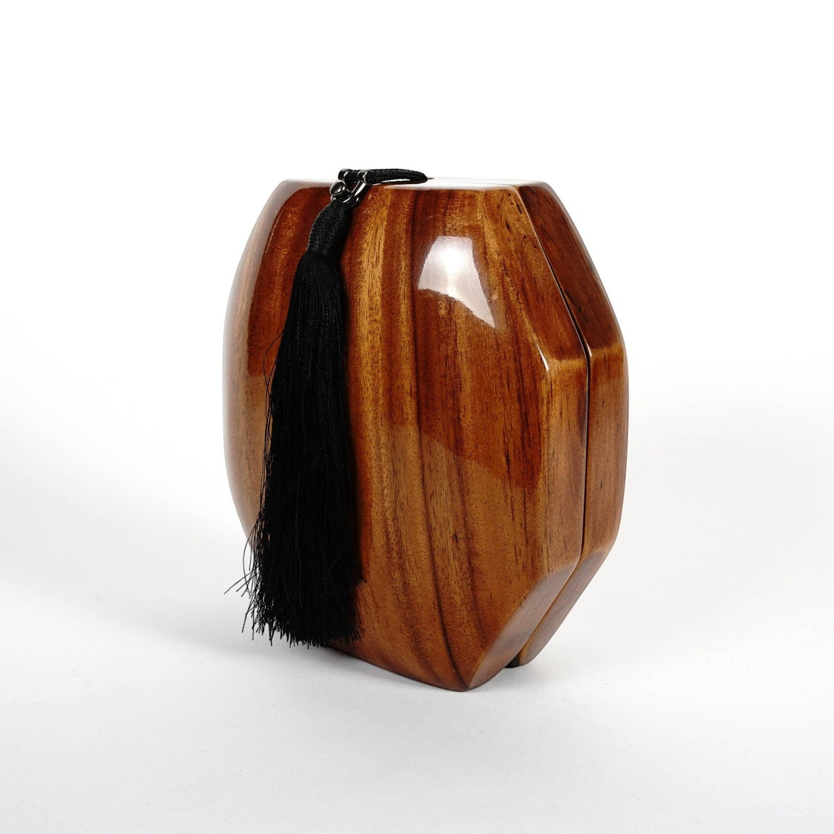 Trebor Style octagon handbag handcrafted from natural acacia wood with a black tassel and matching cord strap.