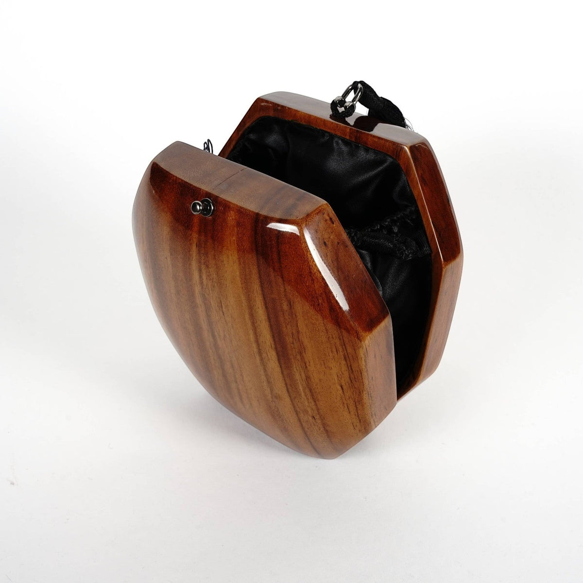 Trebor Style octagon handbag handcrafted from natural acacia wood with a black tassel and satin interior lining.