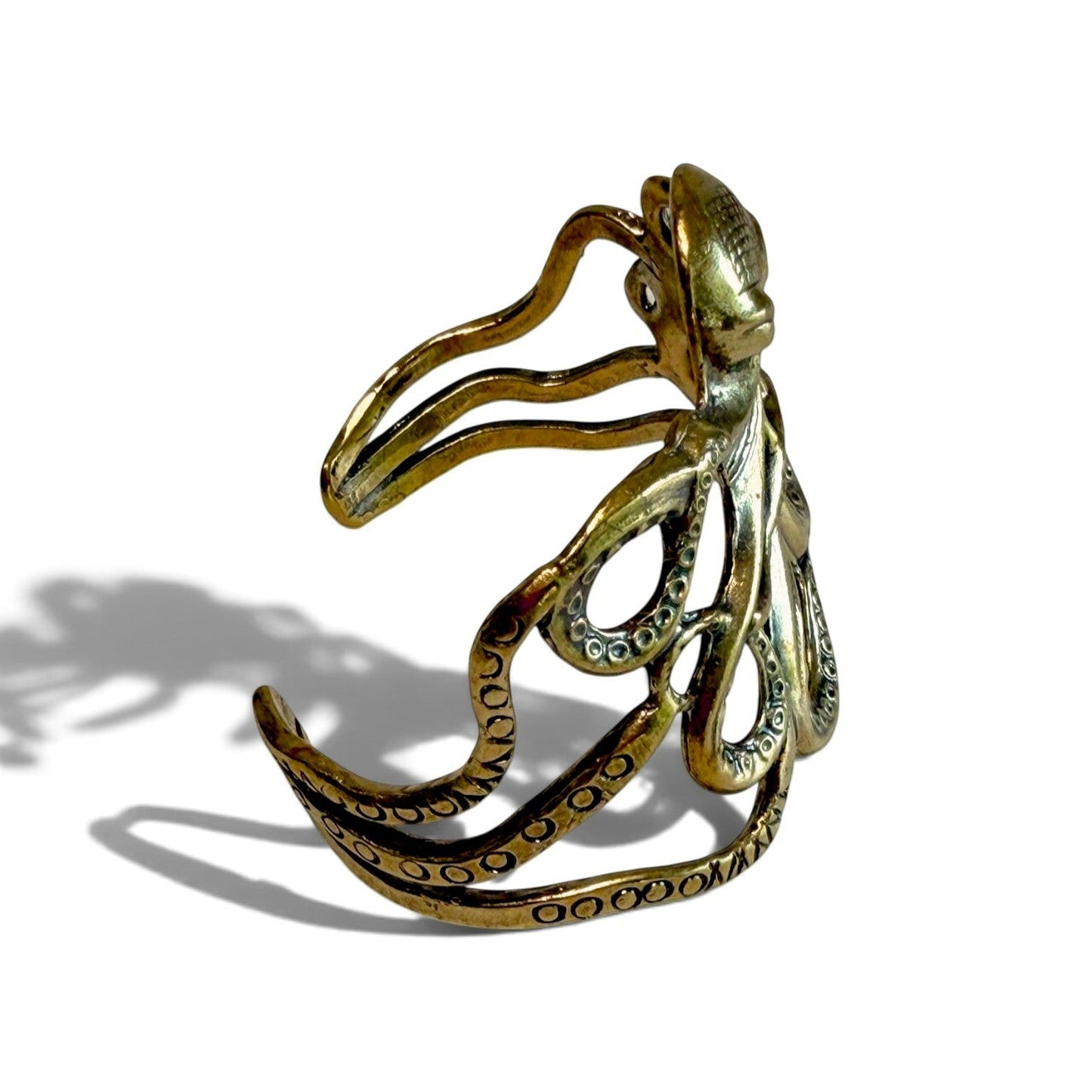 Trebor Style octopus cuff bracelet in antique brass featuring detailed tentacles wrapping around the wrist