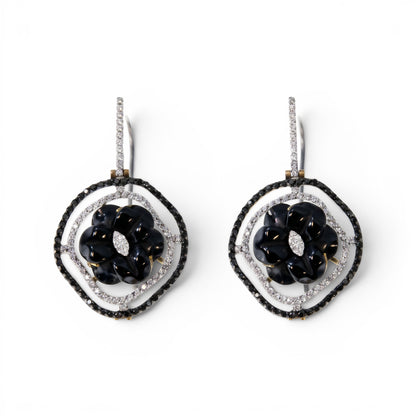 Trebor Style 18k gold drop earrings featuring a black onyx flower, pave white and black diamonds, and a keshi pearl.