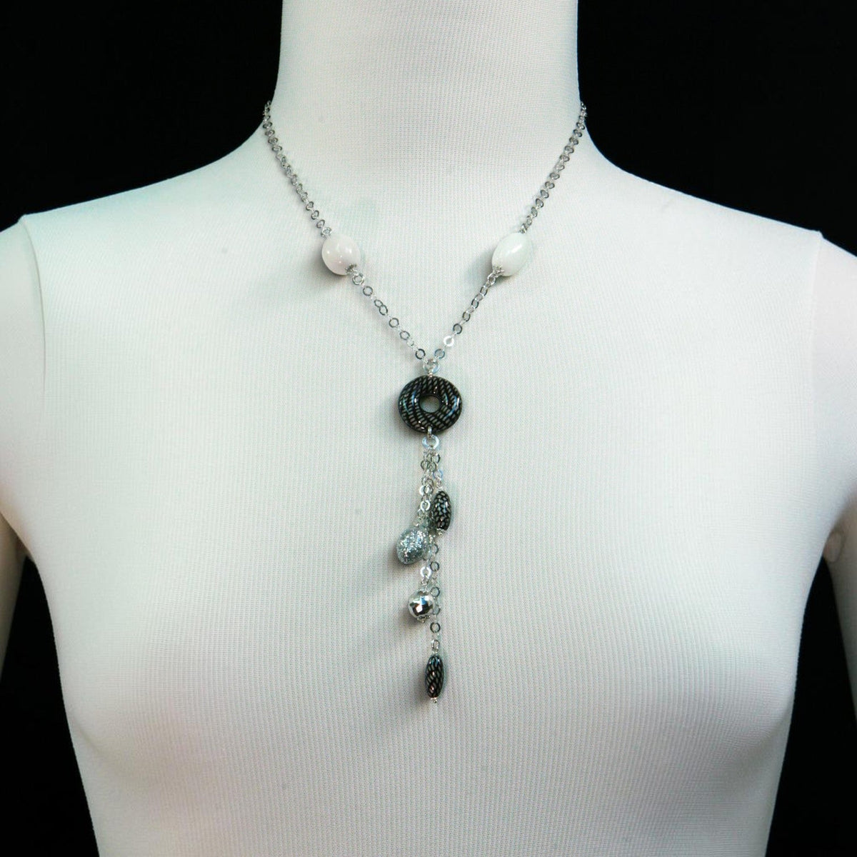 Trebor Style white onyx and enameled sterling silver Y-necklace with a tassel drop on a mannequin display