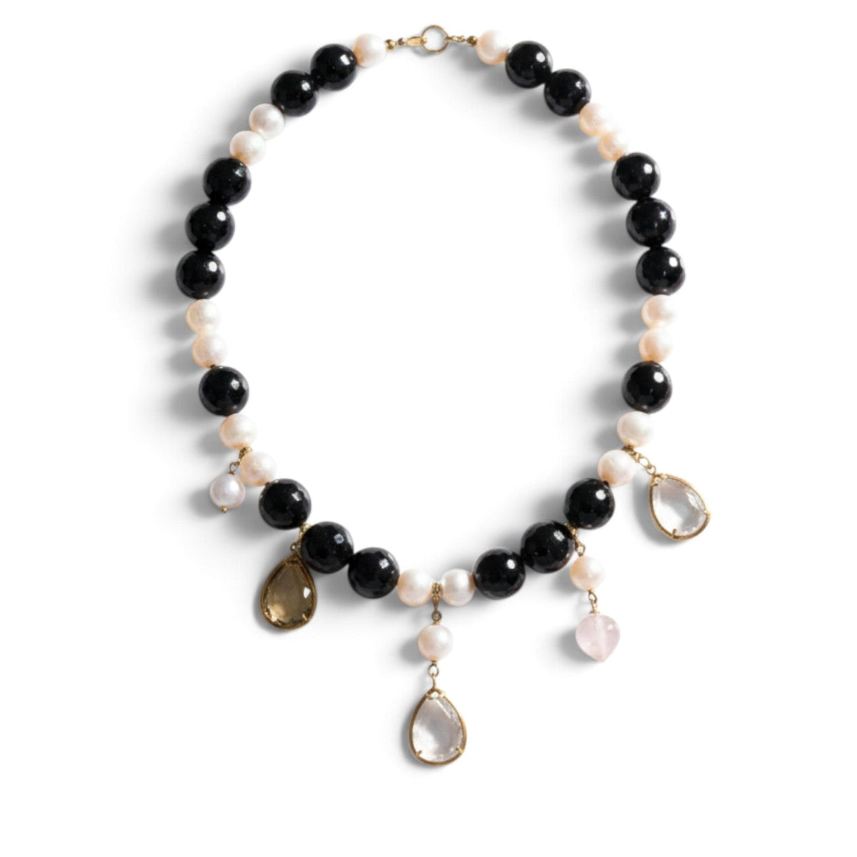 Trebor Style black onyx and white pearl necklace with 18k gold pink and amber quartz charm drops on white background