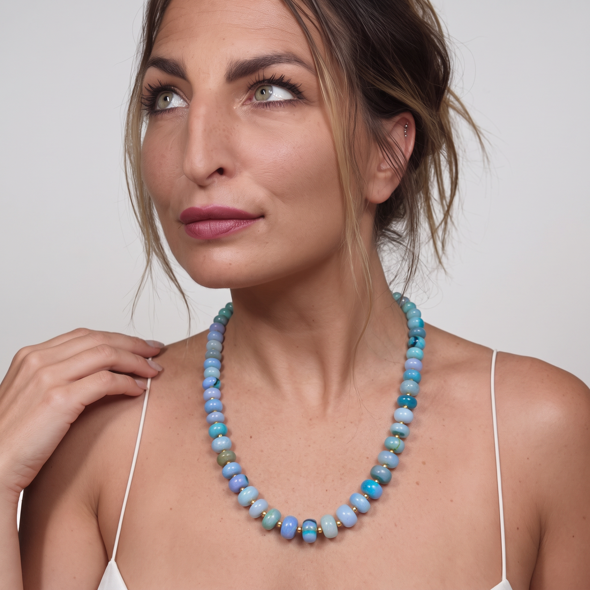 Trebor Style Spring Blues opal beaded necklace with 14k gold-dipped sterling silver accents worn by a woman