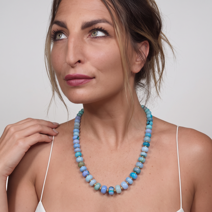 Trebor Style Spring Blues opal beaded necklace with 14k gold-dipped sterling silver accents worn by a woman