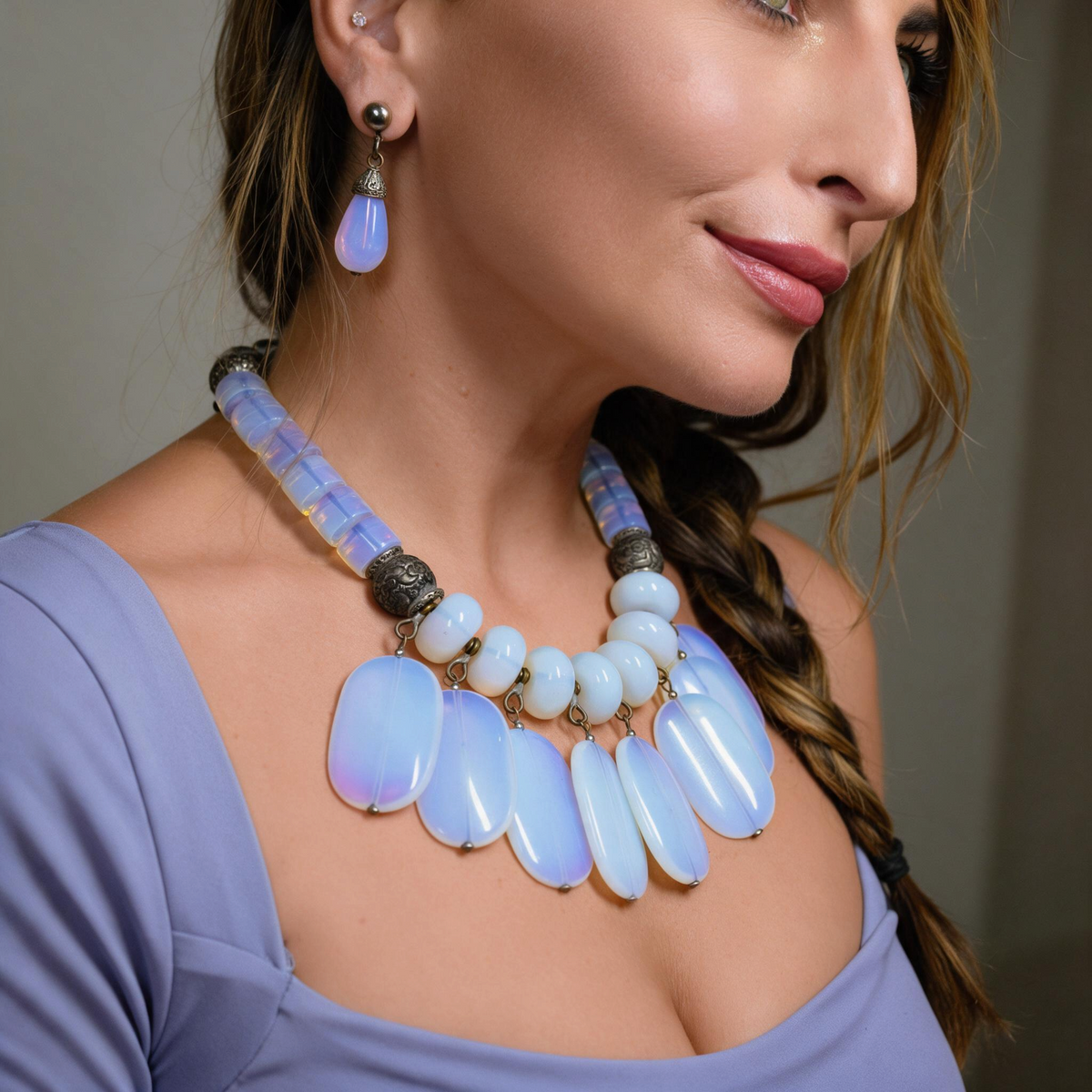 Trebor Style Masha Archer opalite milkglass fringe necklace with silver floral accents worn by a woman