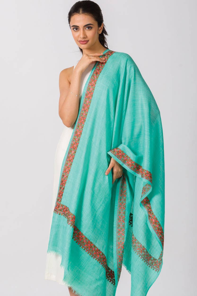 Trebor Style orchid wool blend shawl with intricate hand-embroidered floral borders in peach, pink, and light green.