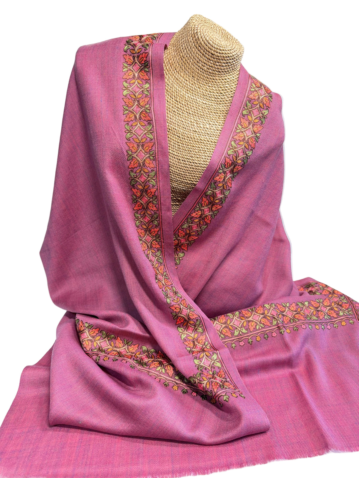 Trebor Style orchid wool blend shawl with intricate peach, pink, and green hand-embroidered floral border details.