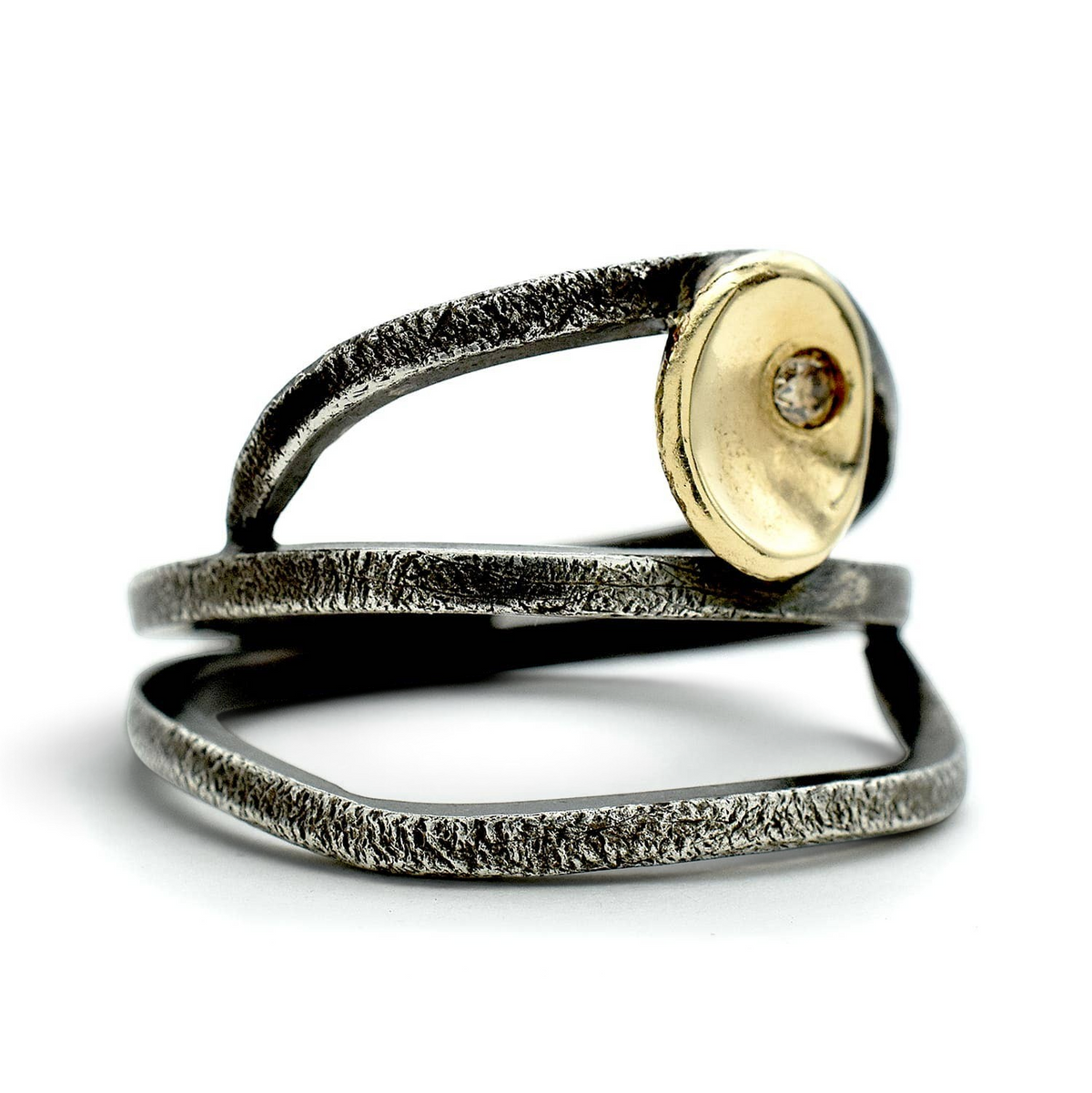 Trebor Style wrap ring in oxidized sterling silver with a 14kt gold cup and a small cognac brown diamond.