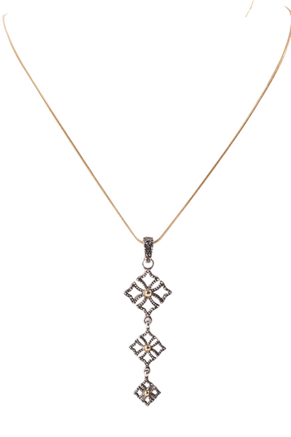 Trebor Style triple drop pendant necklace in oxidized sterling silver with 14k gold beads on a gold-plated chain.