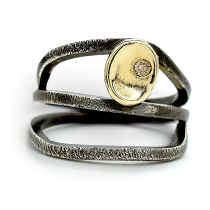 Trebor Style sterling silver wrap ring with textured oxidized finish, 14kt gold cup, and a cognac brown diamond.