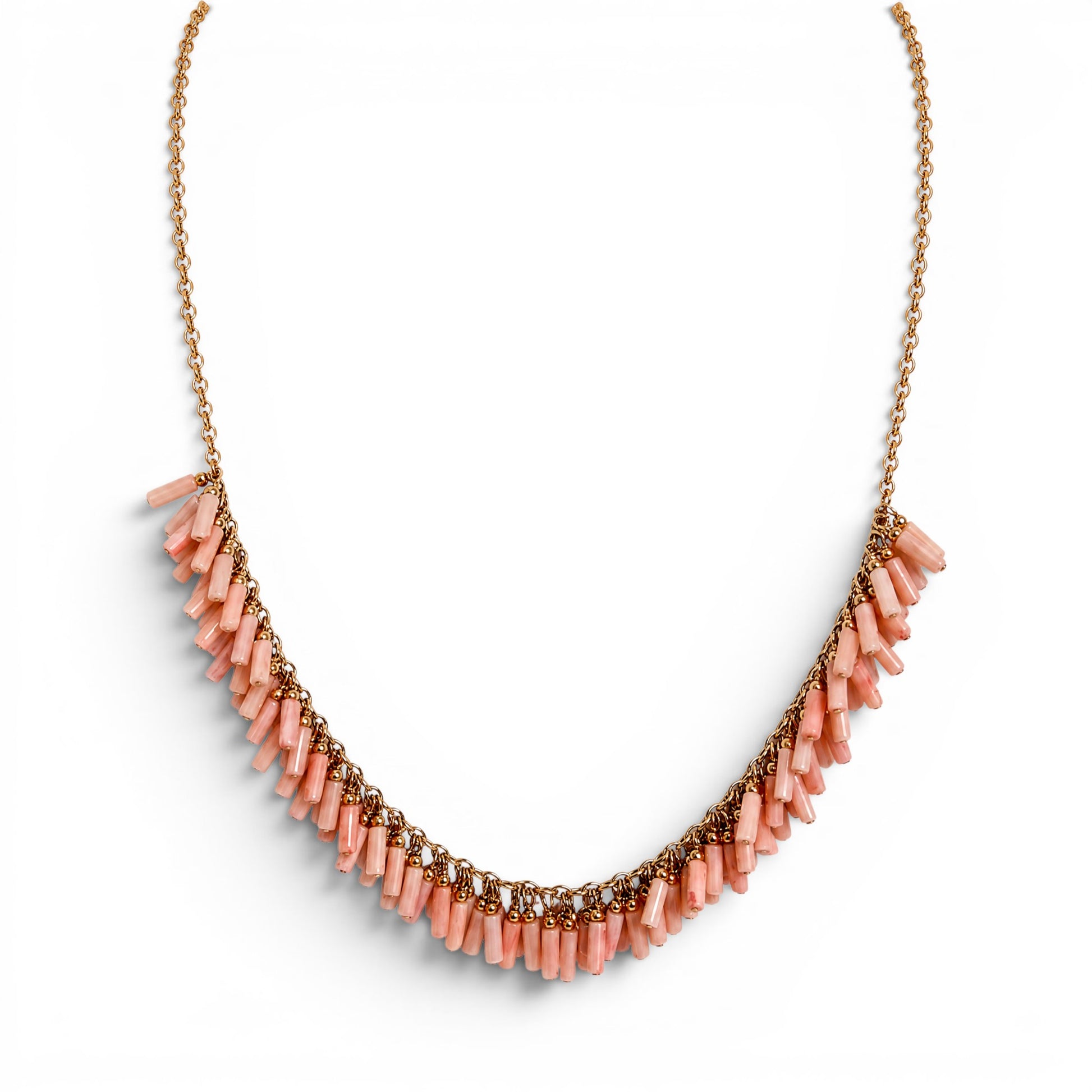 Trebor Style peach coral bead necklace with gold filled chain and fringe design on a white background.